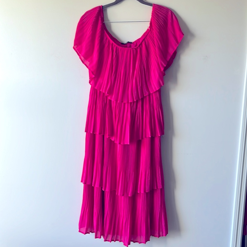 Pink ruffle dress. Optional off-the-shoulder style.